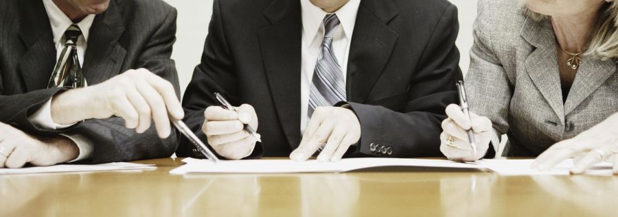 Three accountants executing accounting services